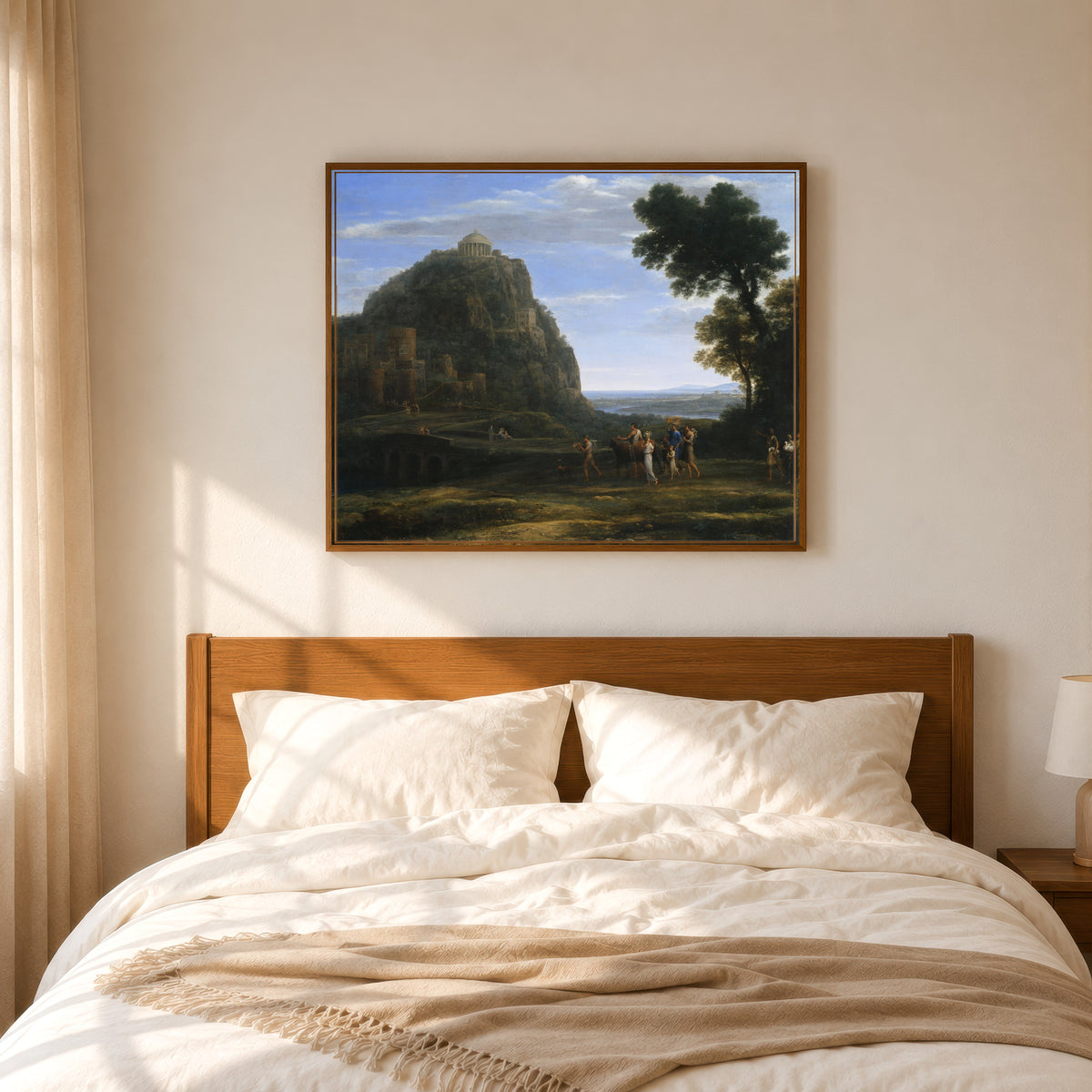 Framed art print of View of Delphi with a Procession by Claude Lorrain, in a slim wood frame above a bed in a sunlit bedroom