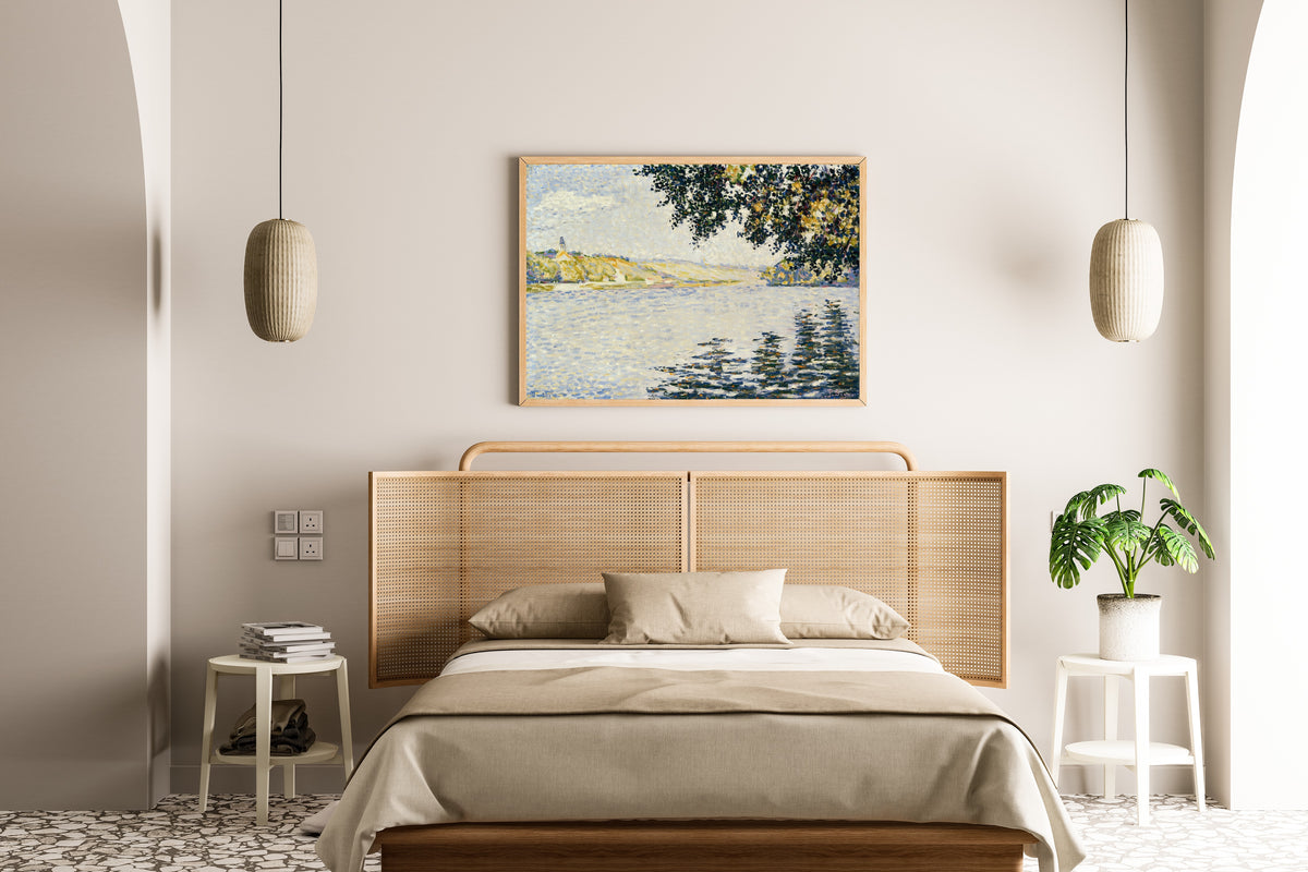 Framed art print of View of the Seine at Herblay by Paul Signac, above a cane-headboard bed