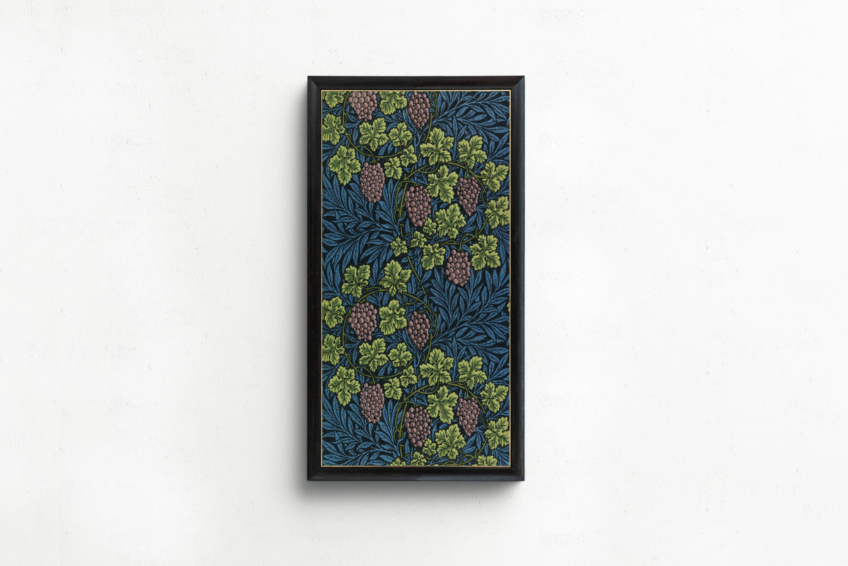 Framed art print of Vine (Blue) by William Morris, in a slim black frame on a plain white wall