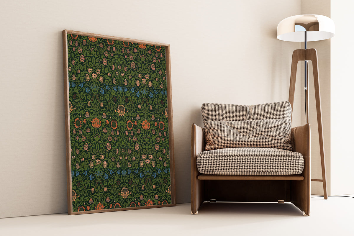 Framed art print of Violet and Columbine by William Morris, leaning against a wall beside an armchair and a floor lamp