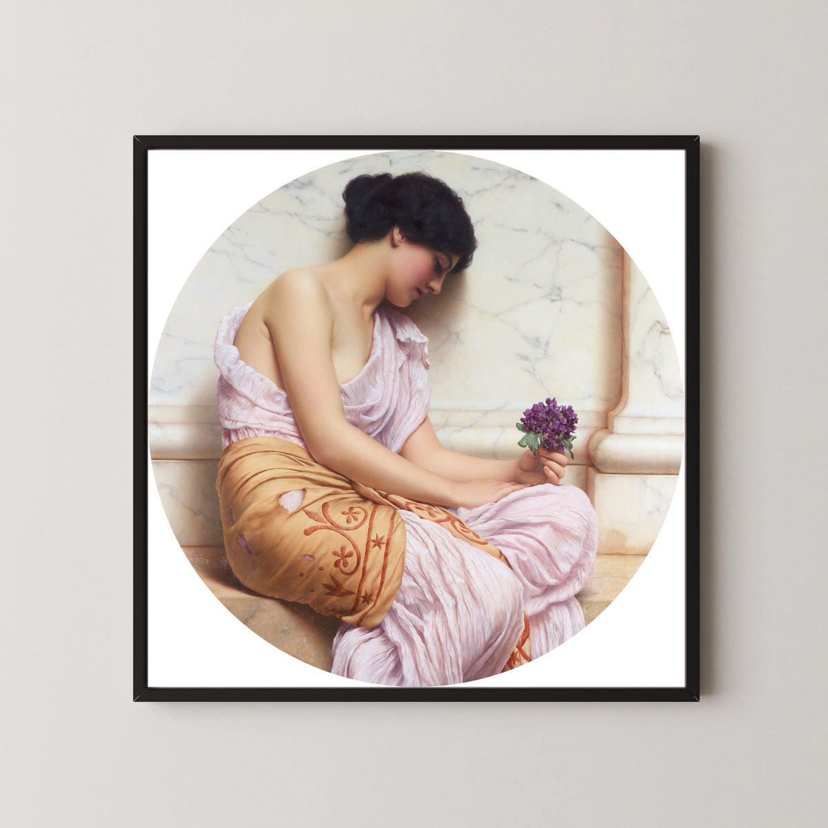 Framed art print of Violets, Sweet Violets by John William Godward, in a black frame on a pale wall