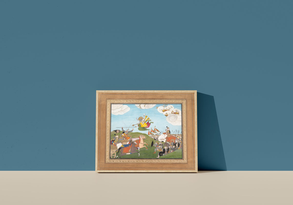 Framed art print of Vishnu as Varaha, the Boar Avatar, Slays Banasur, A Demon General: Page from… by Guler school, in a light wood frame leaning on a blue wall