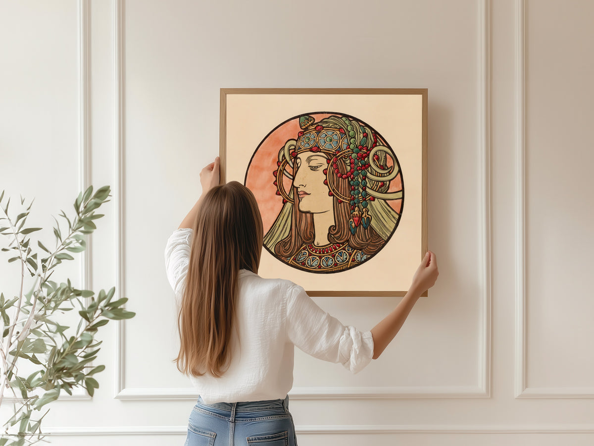 Framed art print of Vitrail pour la façade de la boutique Fouquet (jewelled headdress) by Alphonse Mucha, hung on a panelled wall