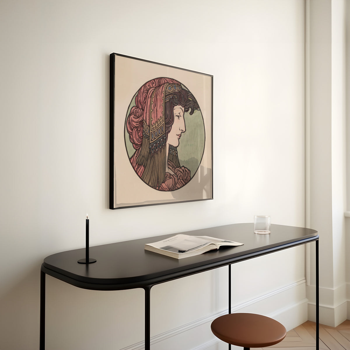 Framed art print of Vitrail pour la façade de la boutique Fouquet (pink headcloth) by Alphonse Mucha, above a slim black console table