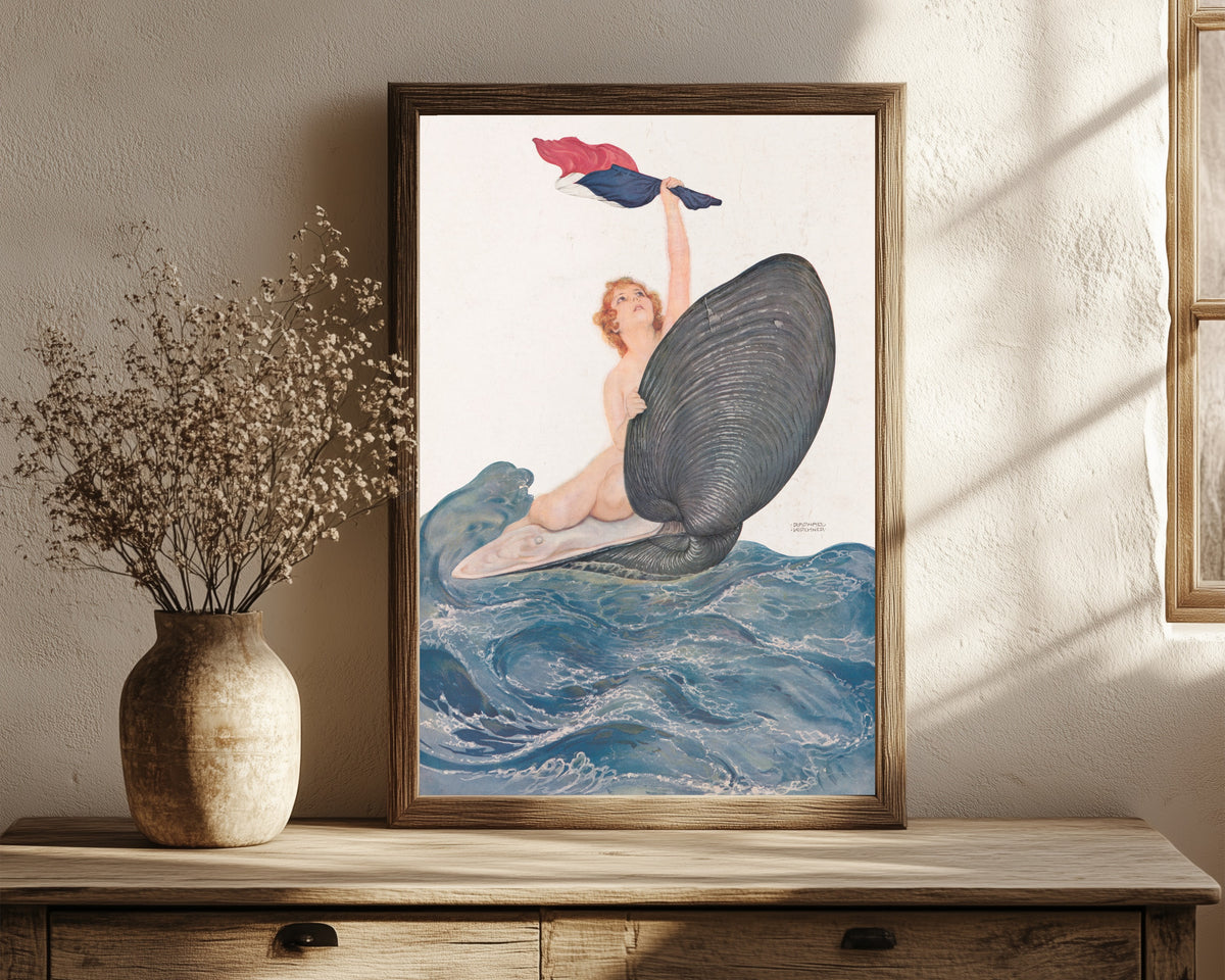 Framed art print of Vive la France by Raphael Kirchner, in a dark wood frame leaning on a rustic console beside dried flowers