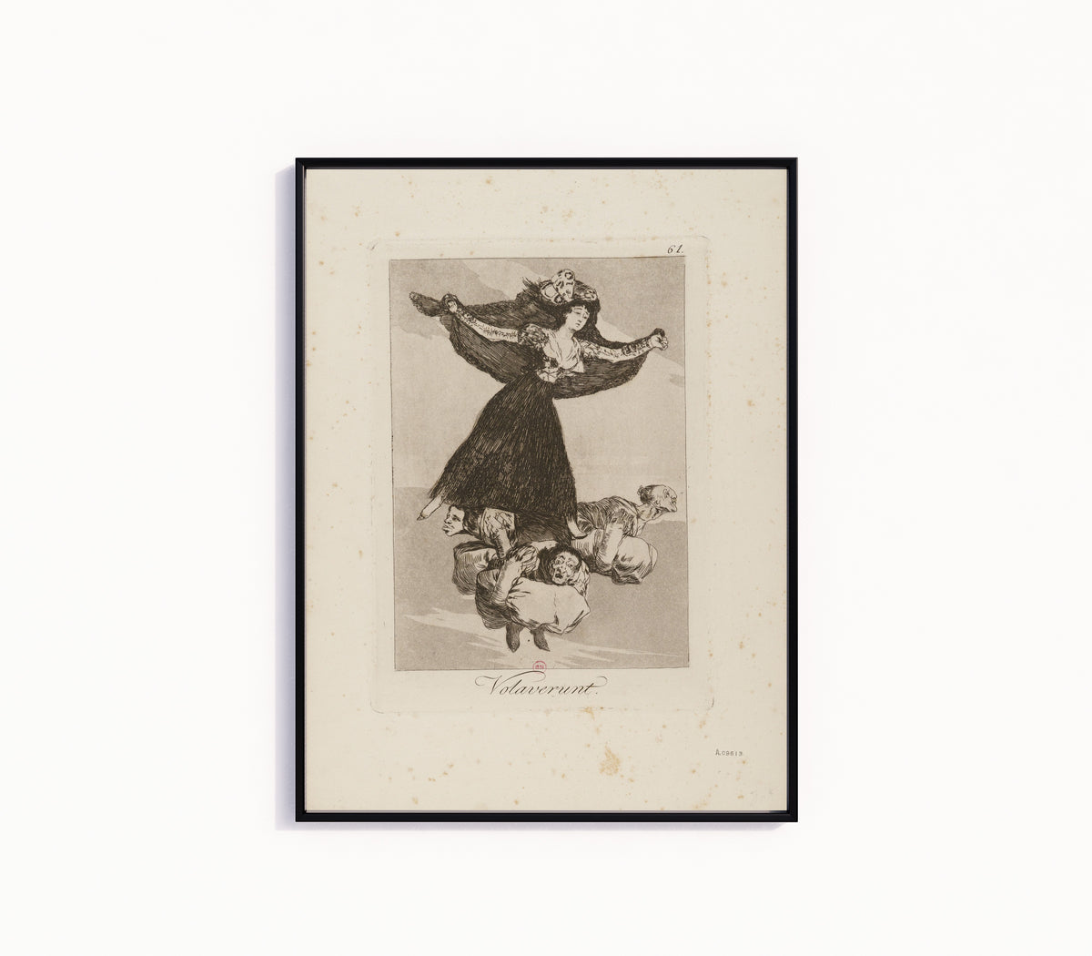 Framed art print of Volaverunt (They Have Flown), Los Caprichos, Plate 61 by Francisco de Goya, in a slim black frame on a plain white wall