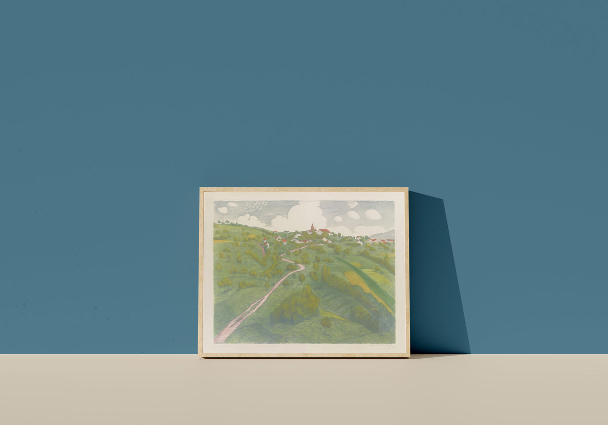Framed art print of Vue de Belmont, près de Lausanne by Théophile Steinlen, in a light wood frame leaning on a blue wall