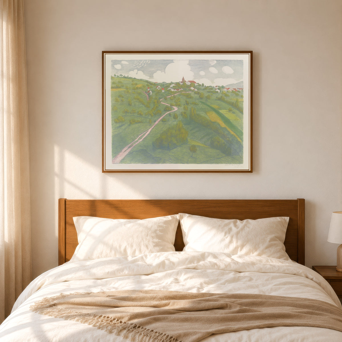 Framed art print of Vue de Belmont, près de Lausanne by Théophile Steinlen, in a slim wood frame above a bed in a sunlit bedroom