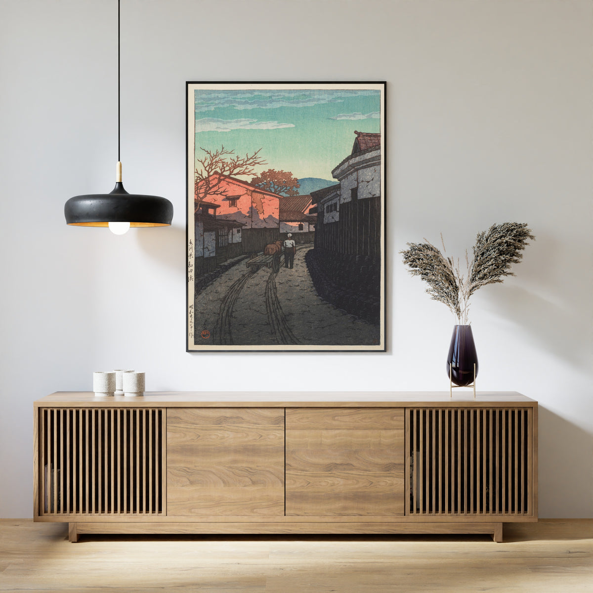 Framed art print of Wadahama in Kagawa Prefecture by Kawase Hasui, above a slatted wood sideboard