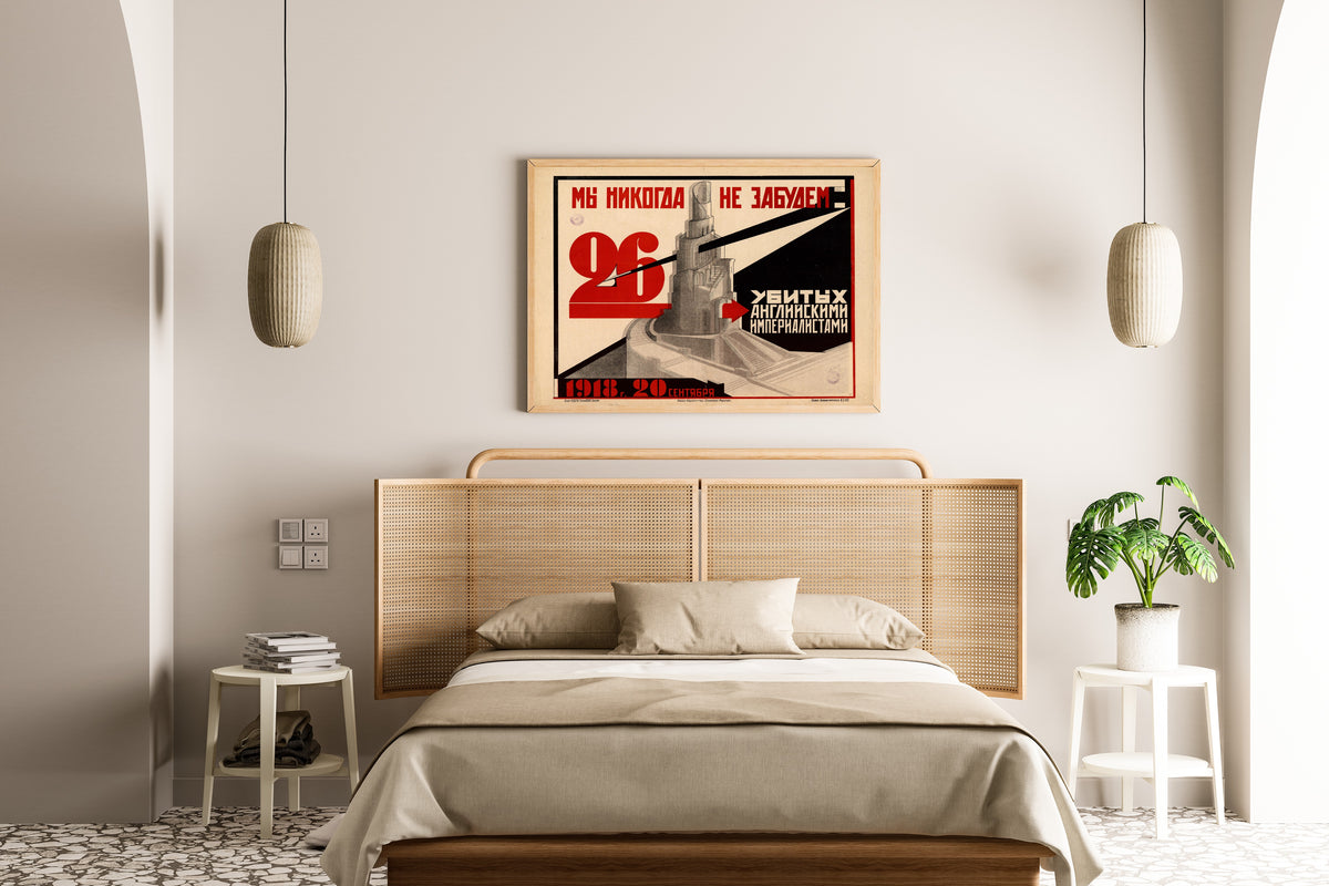 Framed art print of We Will Never Forget the 26 Killed by the English Imperialists. 20 September 1918, above a cane-headboard bed