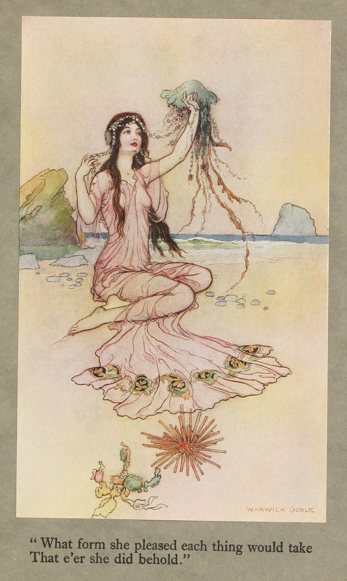 What form she pleased each thing would take that e’er she did behold. by Warwick Goble — A woman on a beach holds up a jellyfish trailing beads