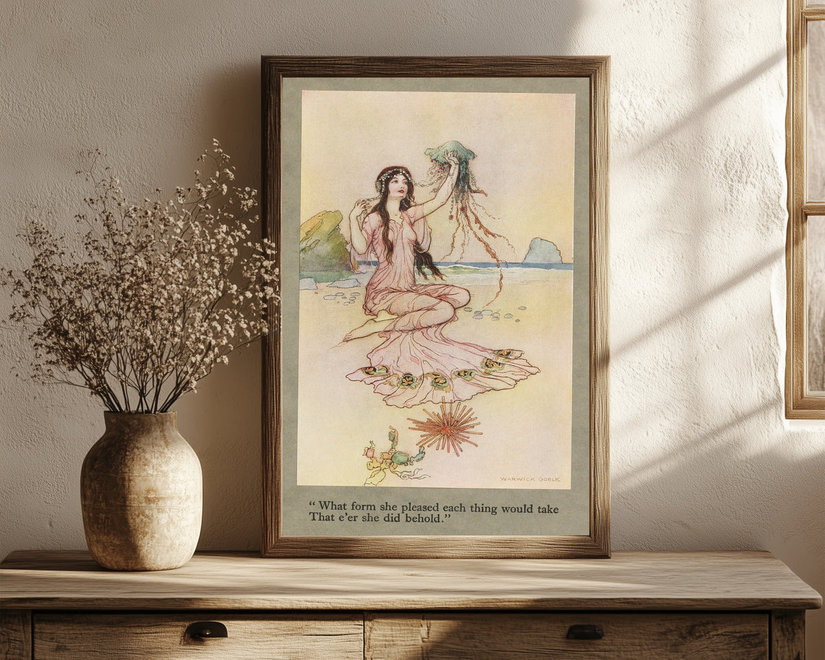 Framed art print of What form she pleased each thing would take that… by Warwick Goble, in a dark wood frame leaning on a rustic console beside dried flowers
