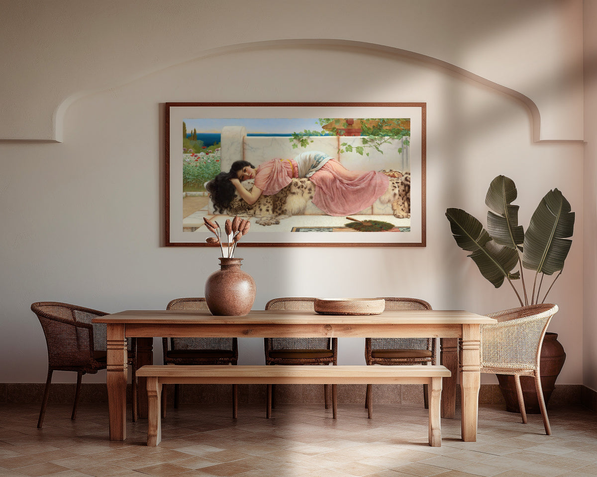 Framed art print of When the Heart is Young by John William Godward, above a wooden dining table