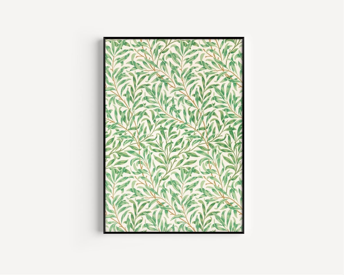 Framed art print of Willow Bough by William Morris, in a slim black frame on a plain white wall