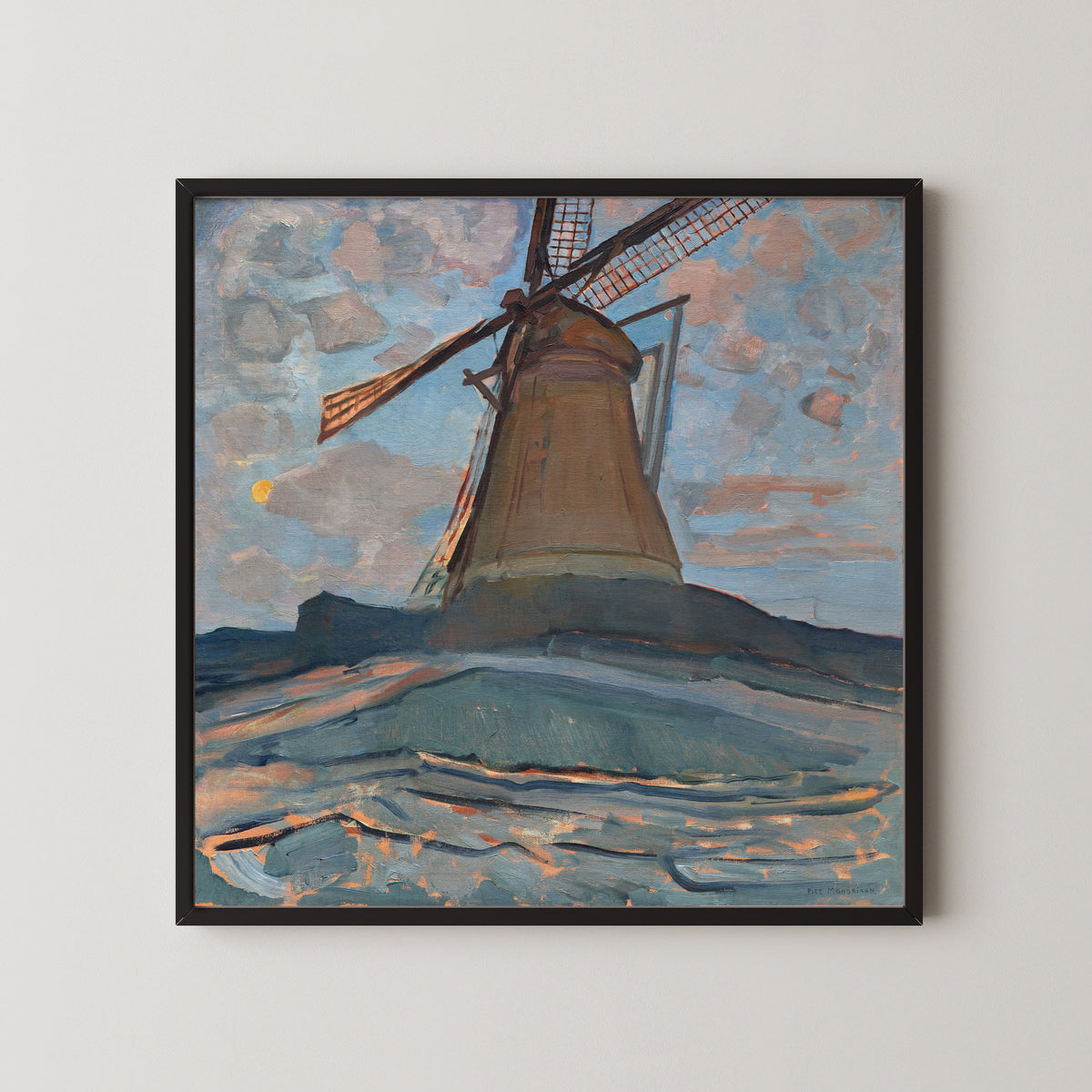 Framed art print of Windmill by Piet Mondrian, in a black frame on a pale wall