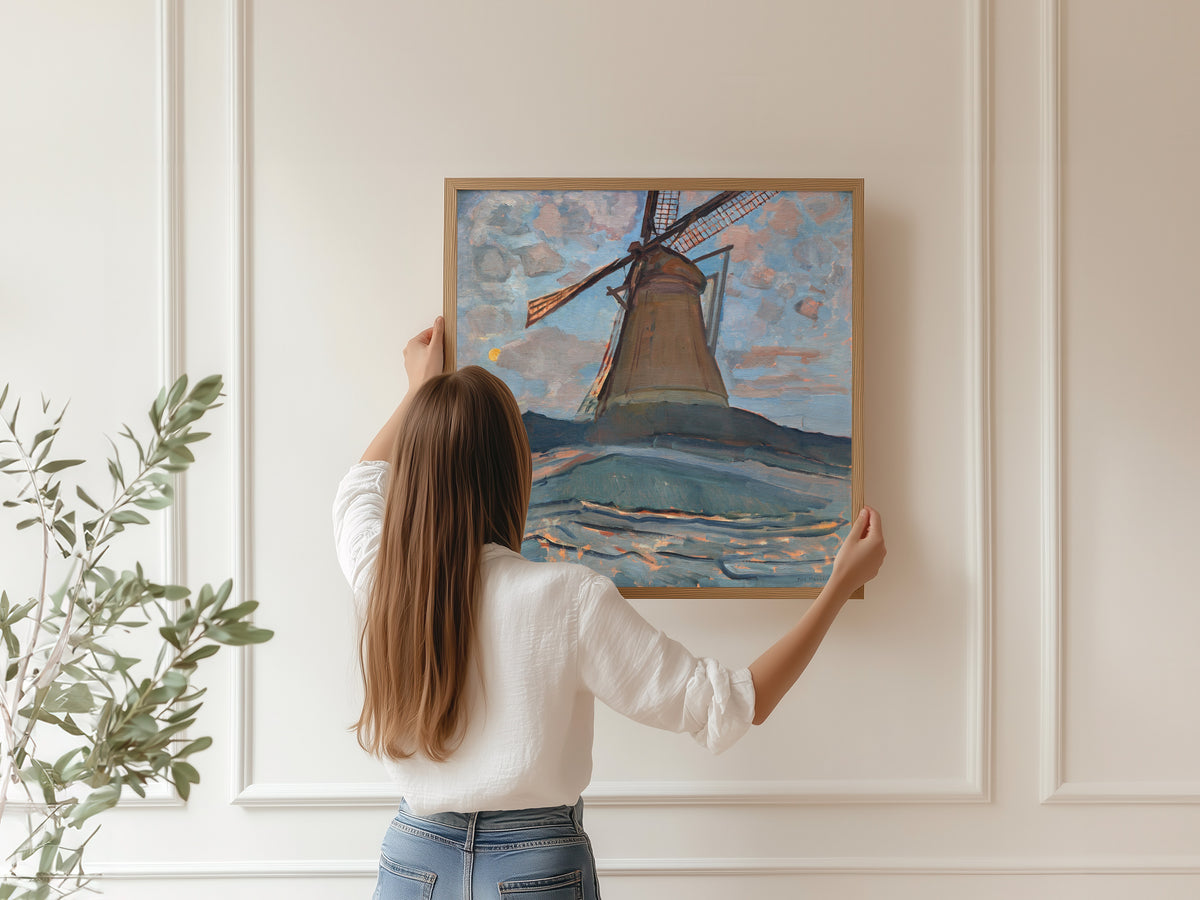 Framed art print of Windmill by Piet Mondrian, hung on a panelled wall