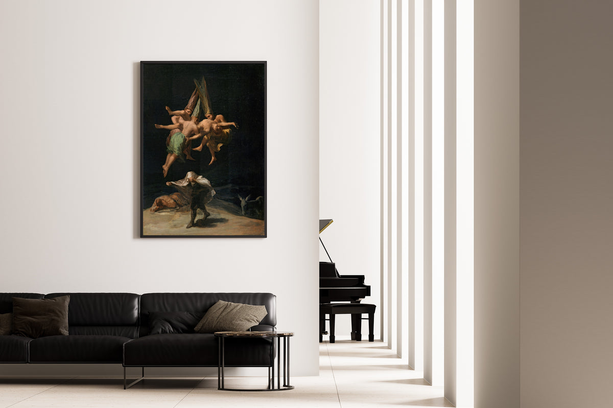 Framed art print of Witches' Flight by Francisco de Goya, on the wall of a minimal living room