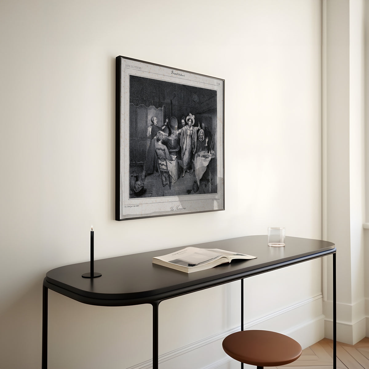 Framed art print of Witches Putting a Creature in a Boiling Cauldron by Unknown artist, above a slim black console table