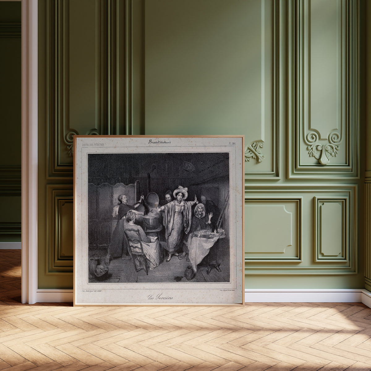 Framed art print of Witches Putting a Creature in a Boiling Cauldron by Unknown artist, leaning against olive-green panelling on a herringbone floor
