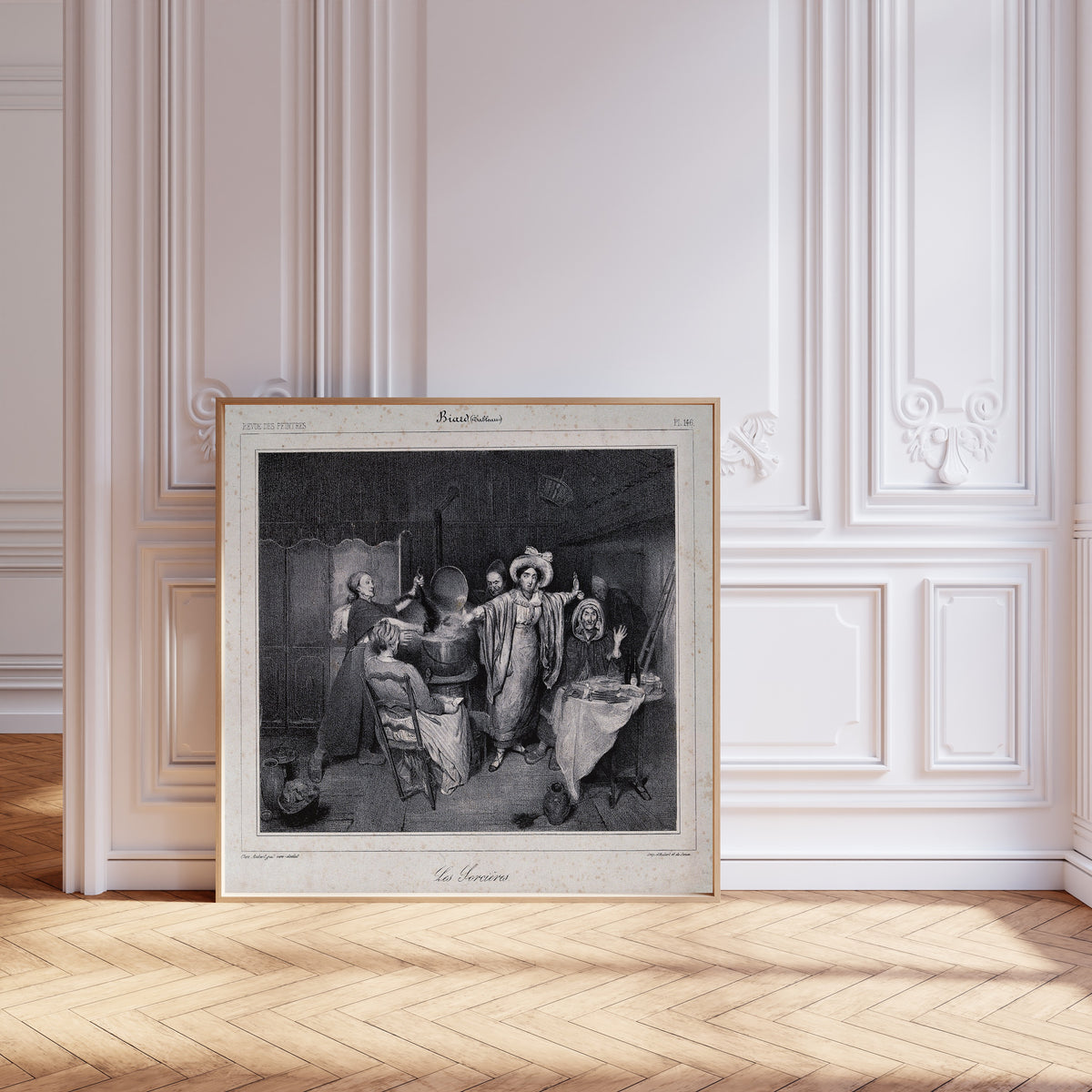 Framed art print of Witches Putting a Creature in a Boiling Cauldron by Unknown artist, leaning against pale pink panelling on a herringbone floor