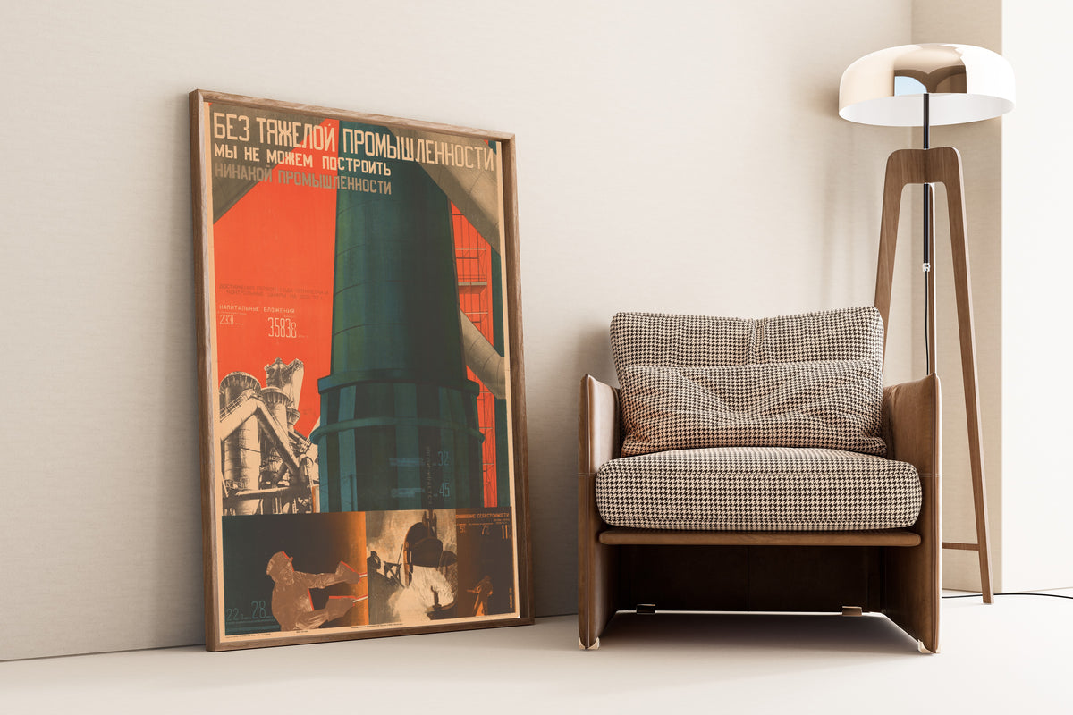 Framed art print of Without Heavy Industry We Cannot Build Any Industry by Gustav Klutsis, leaning against a wall beside an armchair and a floor lamp