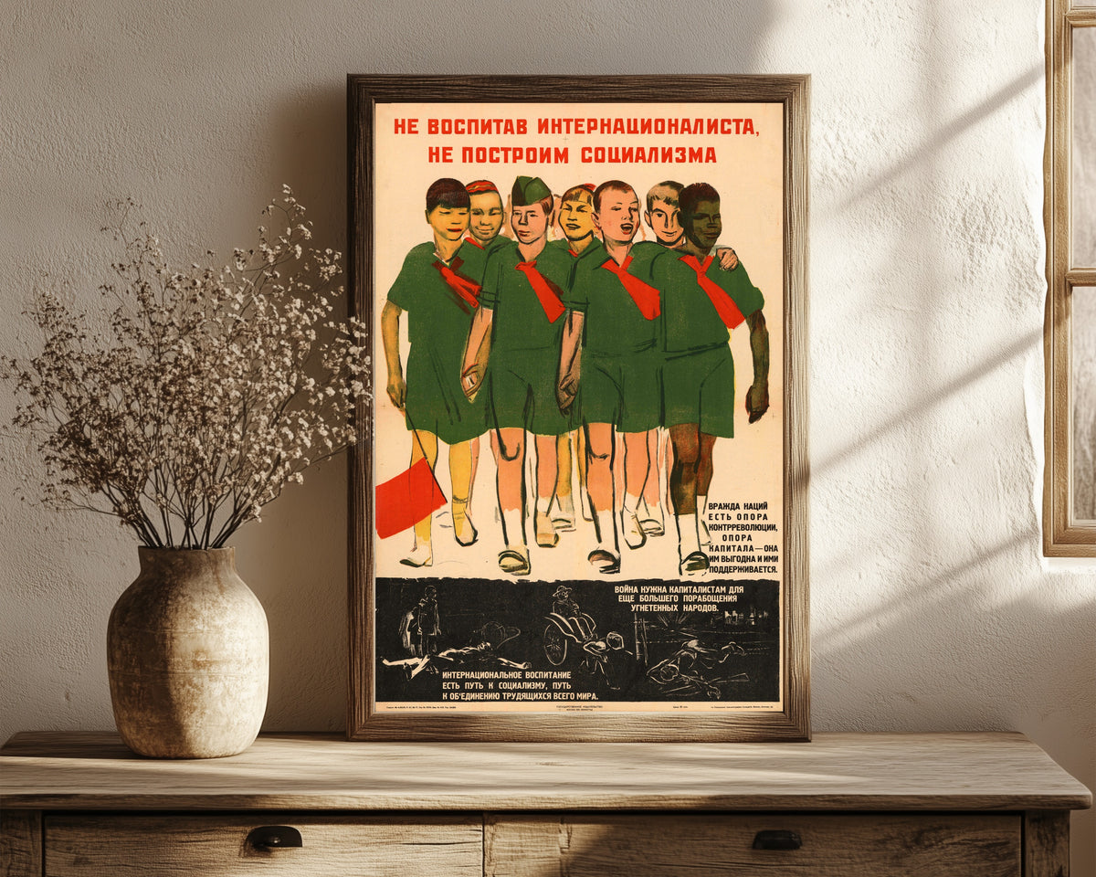 Framed art print of Without bringing up an internationalist, we will not build socialism, in a dark wood frame leaning on a rustic console beside dried flowers