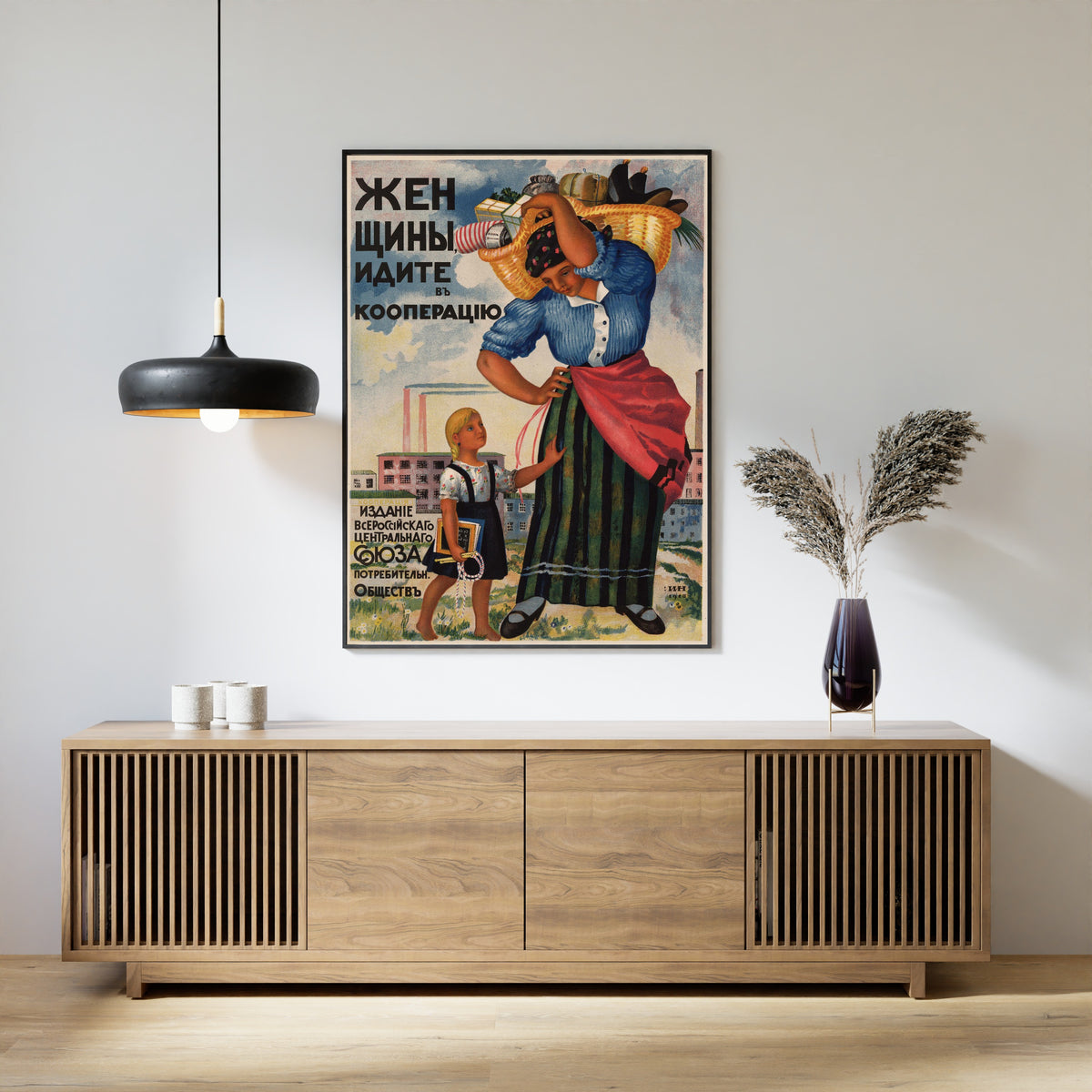 Framed art print of Women, Join the Cooperative by Ignaty Nivinsky, above a slatted wood sideboard