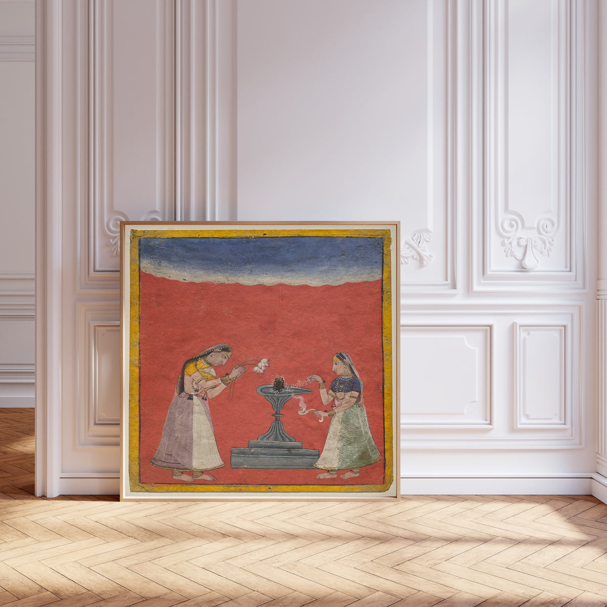 Framed art print of Women worshiping a Shiva linga: Devagandhari Ragini of Hindol… by Pahari school, leaning against pale pink panelling on a herringbone floor