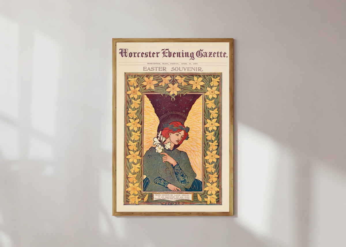 Framed art print of Worcester Evening Gazette, Easter Souvenir by Louis Rhead, in a light wood frame on a sunlit white wall