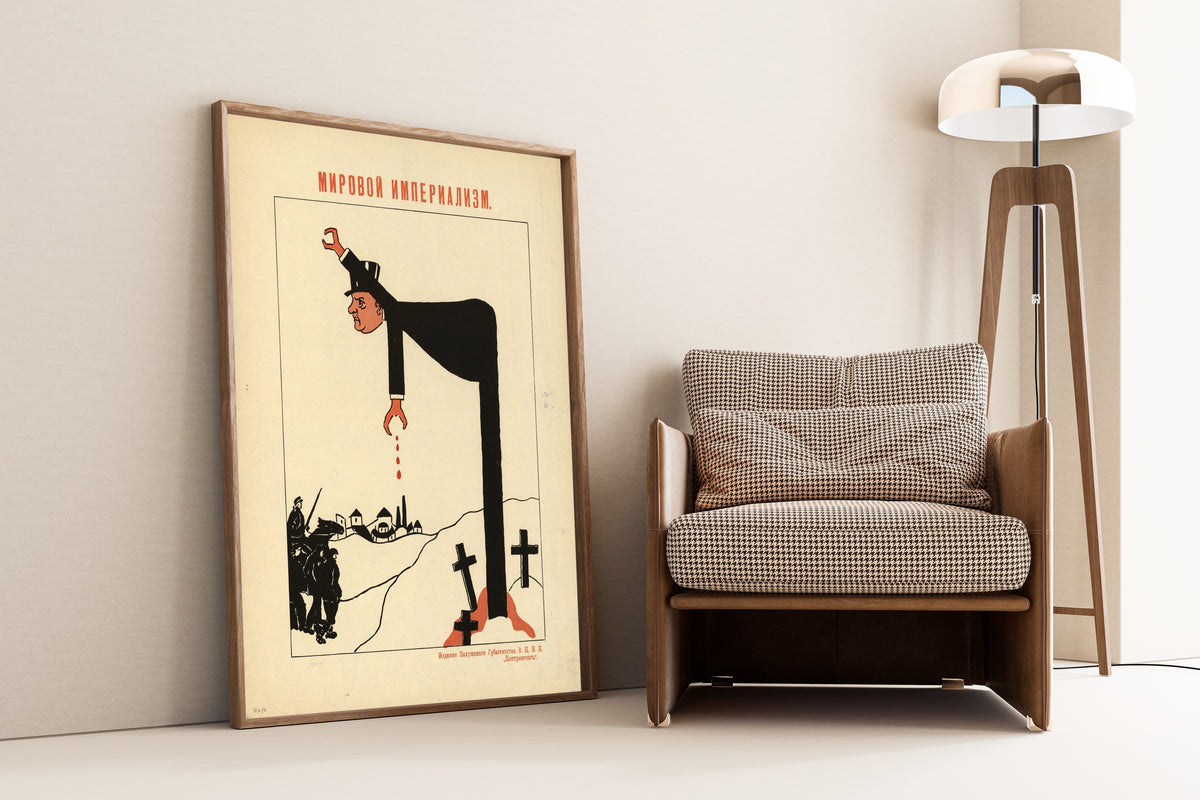 Framed art print of World Imperialism, leaning against a wall beside an armchair and a floor lamp