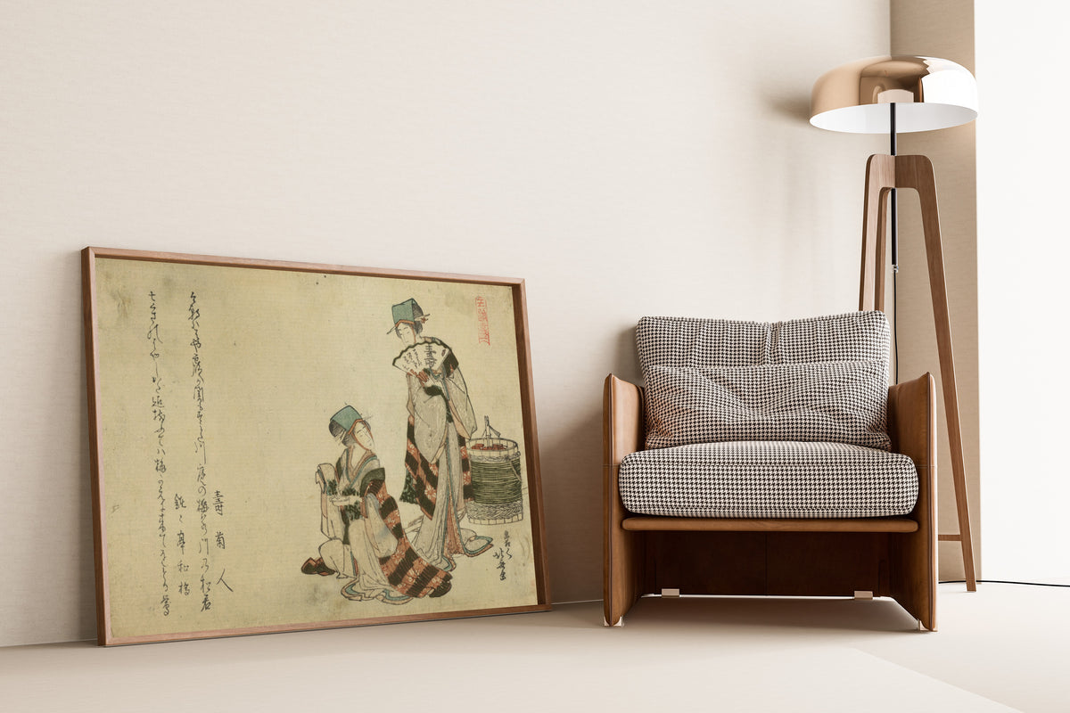 Framed art print of Yoshiwara suzume by Katsushika Hokusai, leaning against a wall beside an armchair and a floor lamp