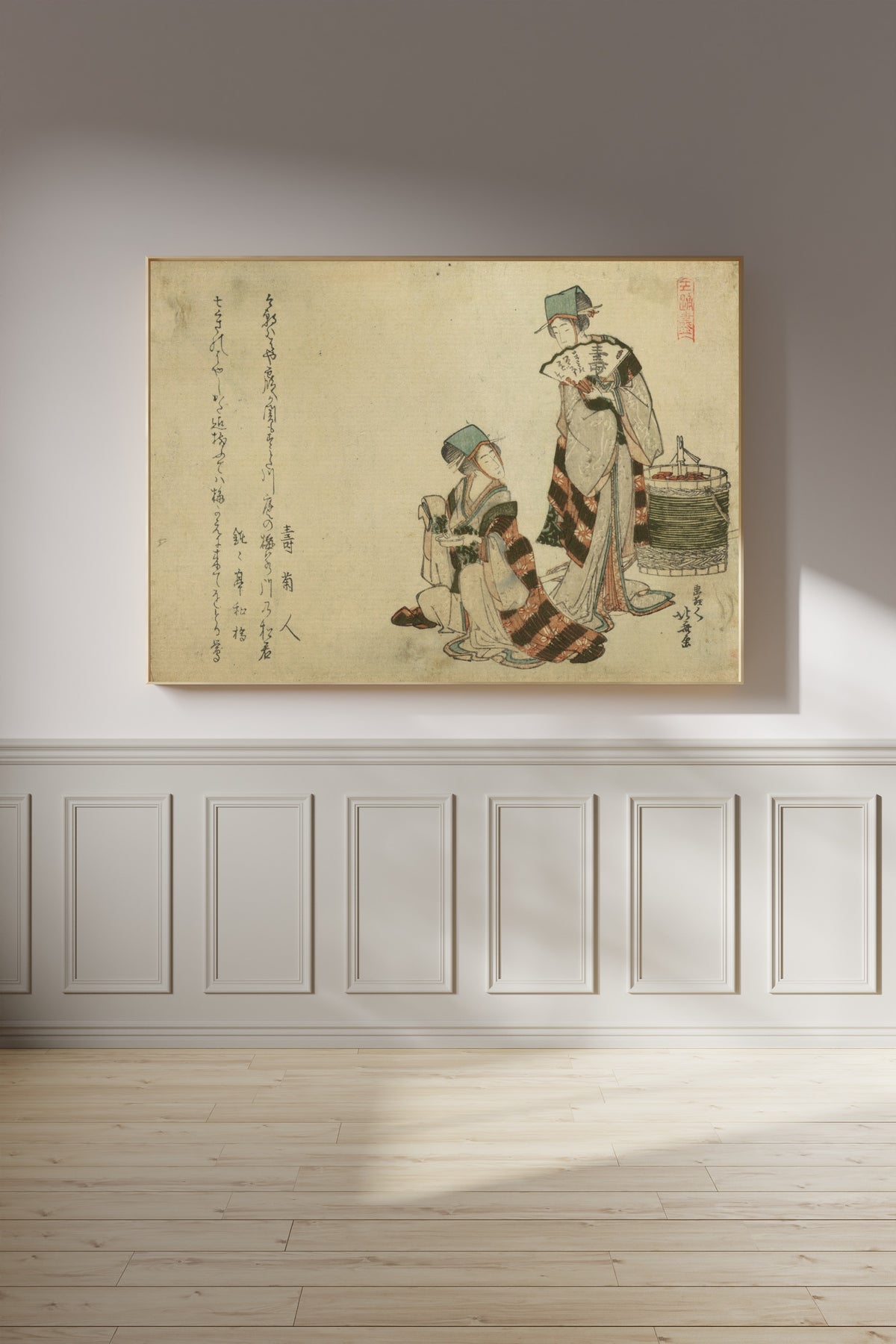 Framed art print of Yoshiwara suzume by Katsushika Hokusai, on a panelled wall in afternoon light