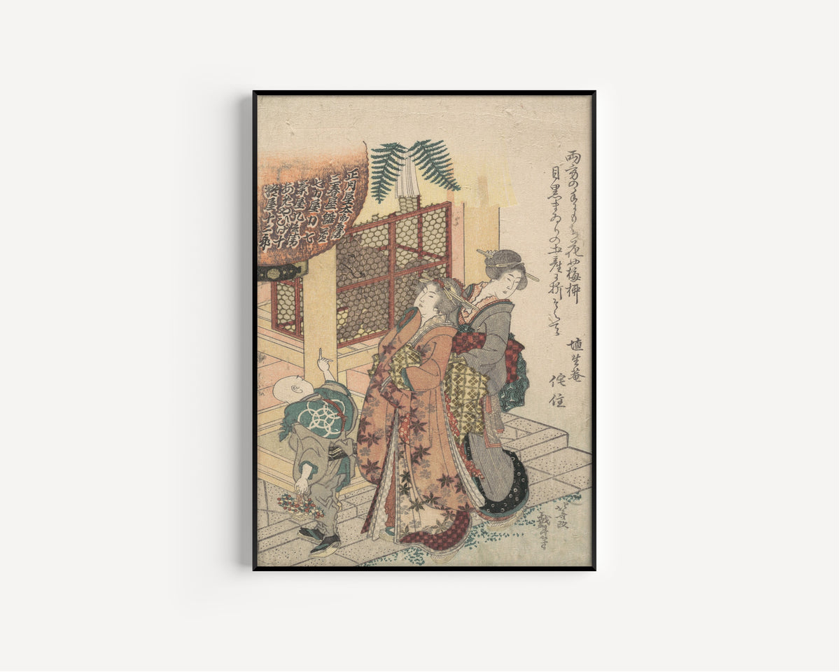 Framed art print of Young Ladies Paying Homage to a Shrine by Katsushika Hokusai, in a slim black frame on a plain white wall