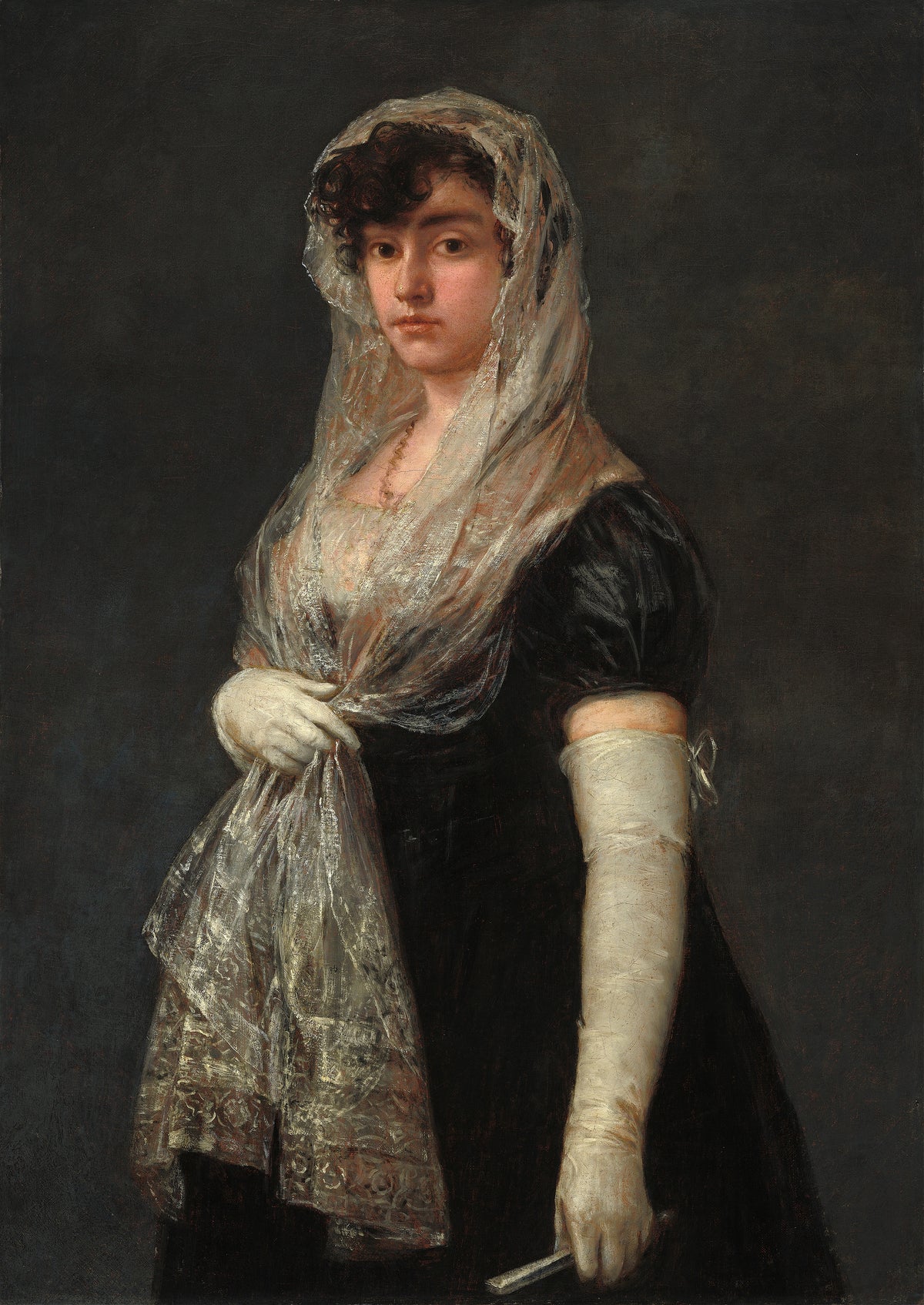 Young Lady Wearing a Mantilla and Basquina by Francisco de Goya — A young woman in a sheer lace mantilla and long white gloves