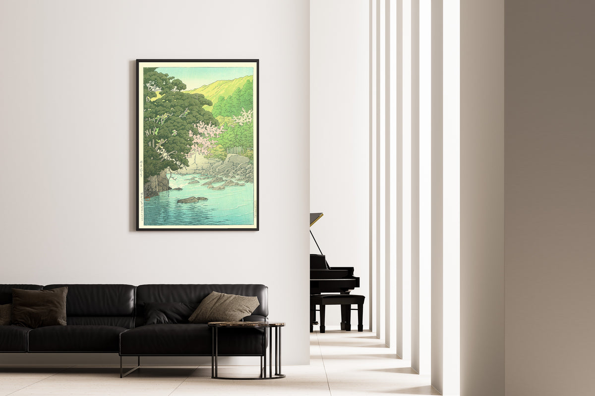 Framed art print of Yugashima, Izu by Kawase Hasui, on the wall of a minimal living room