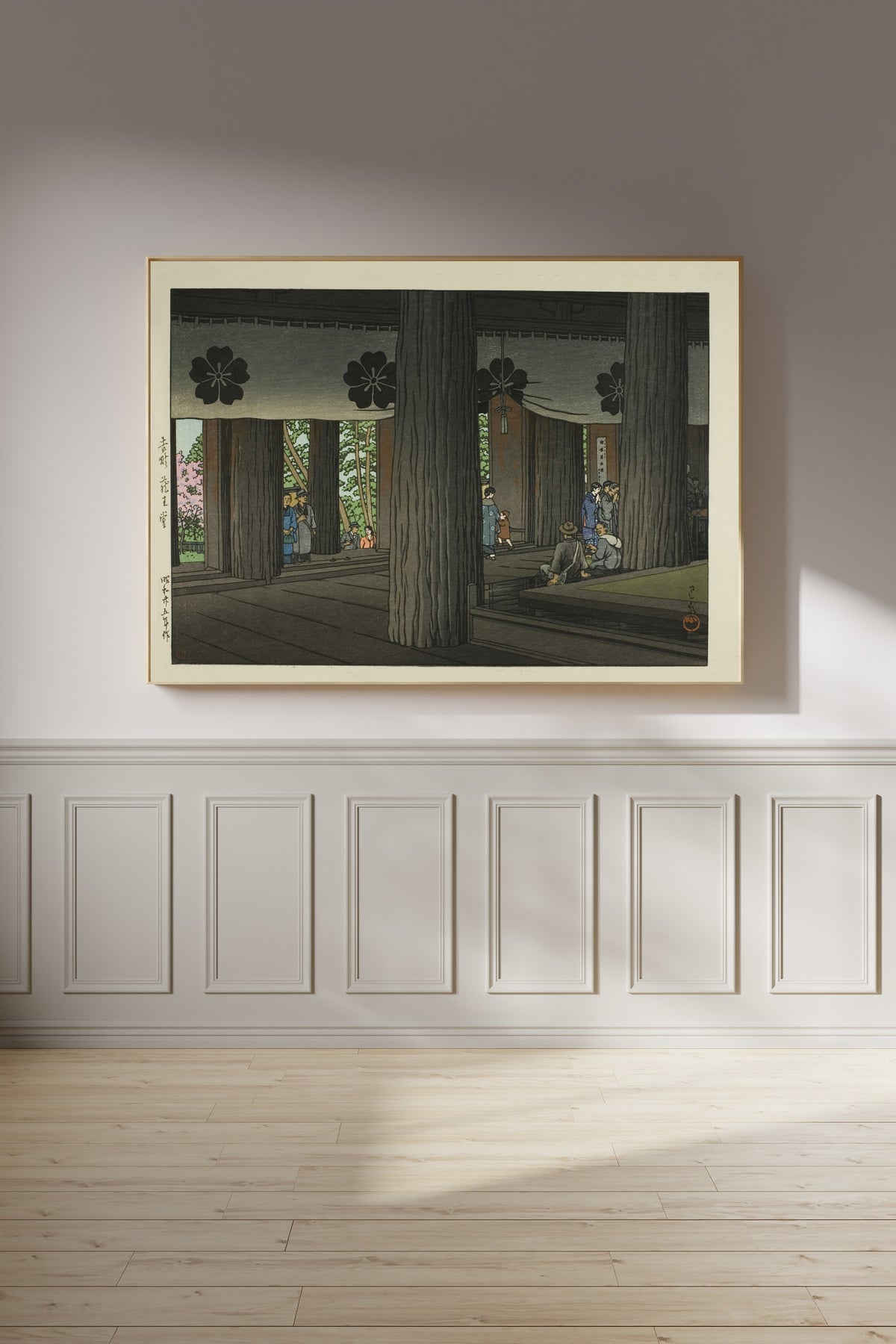 Framed art print of Zao Hall, Yoshino by Kawase Hasui, on a panelled wall in afternoon light