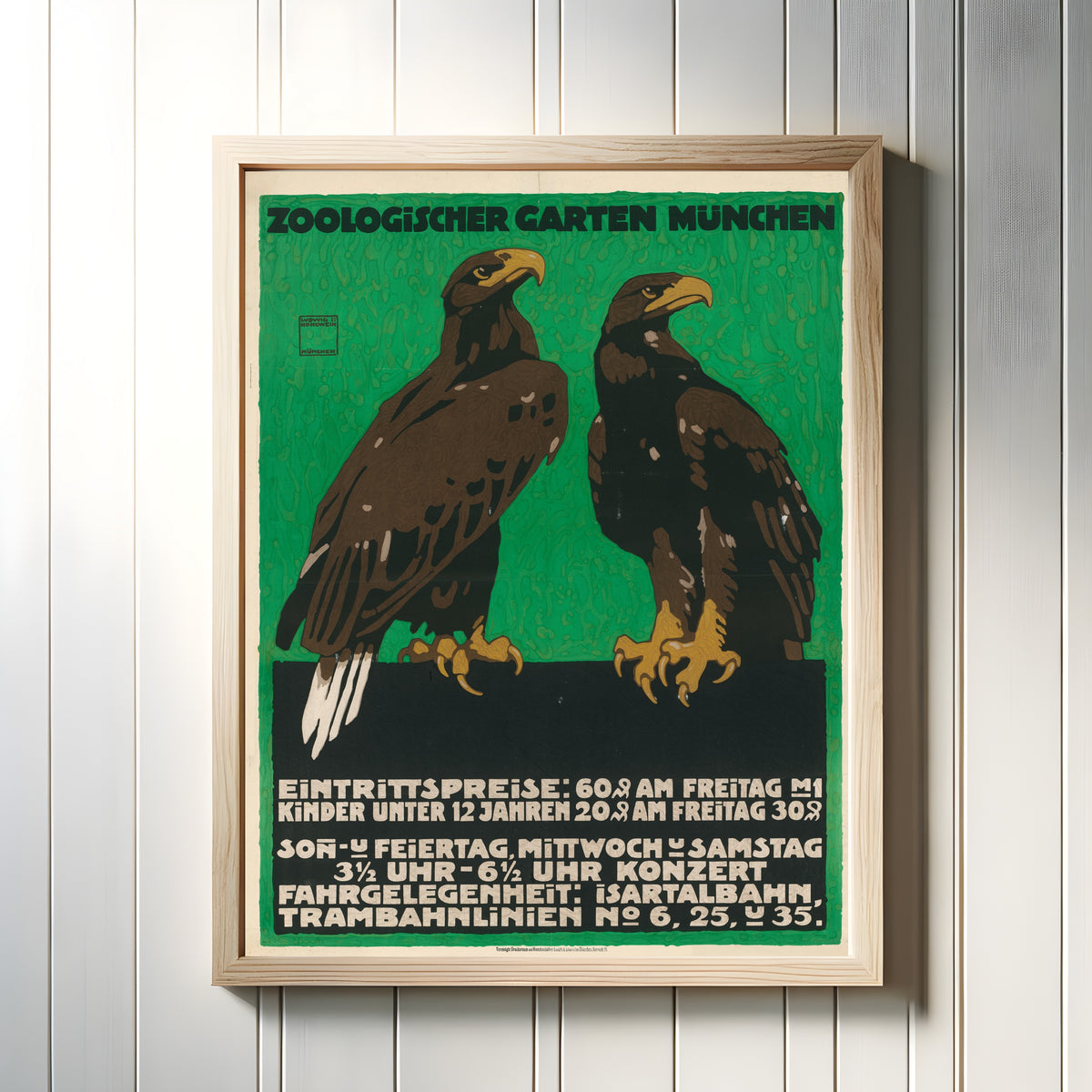 Framed art print of Zoologischer Garten München (Eagles) by Ludwig Hohlwein, in a light wood frame on a white panelled wall