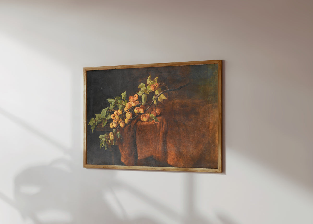 Framed art print of Apricot Branch by Adam Ludwig Kunz, in a light wood frame on a sunlit white wall, seen at a slight angle