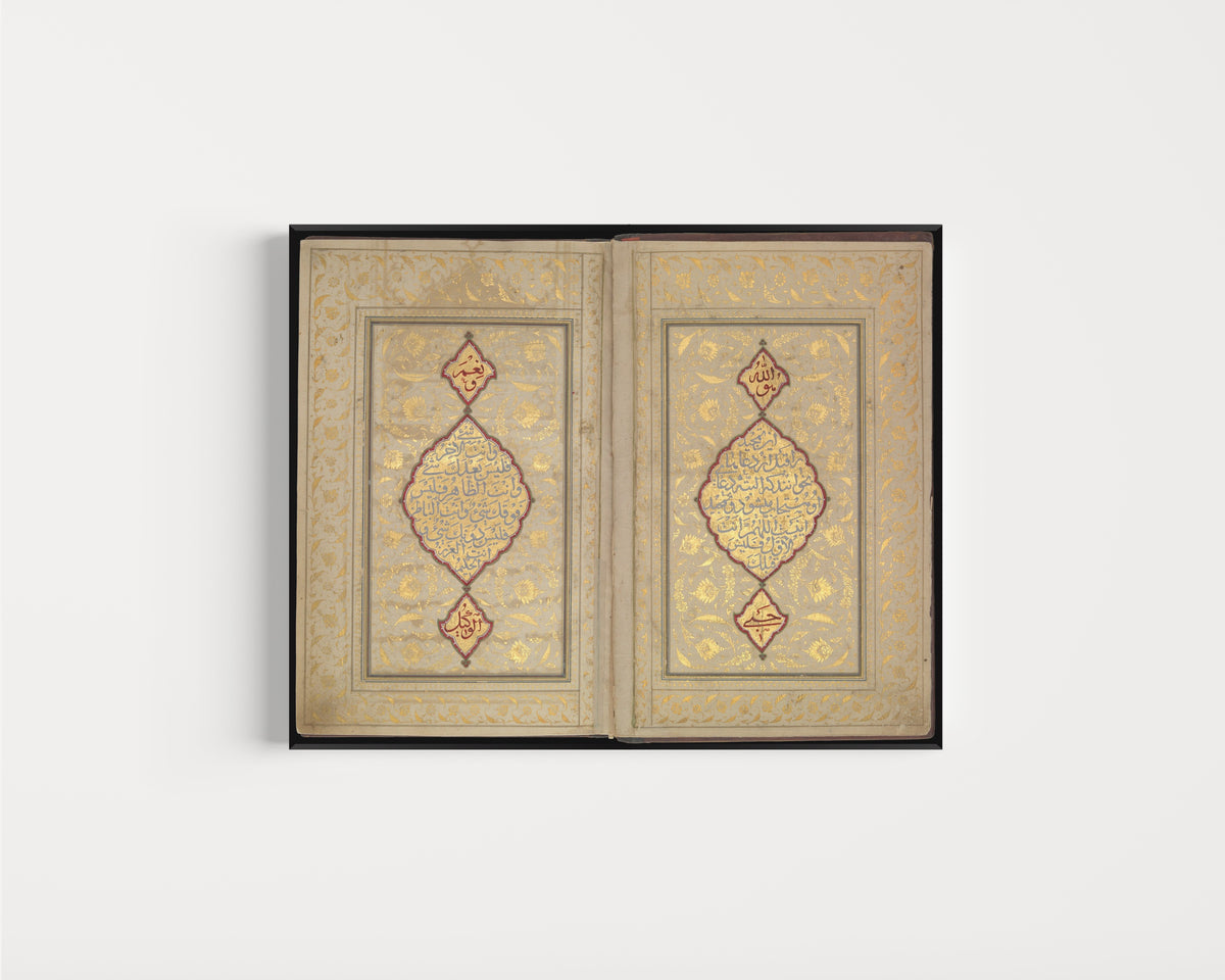 Framed art print of Book of Prayers: Illuminated Opening with Gold Medallions by Ahmad Nairizi, in a slim black frame on a plain white wall