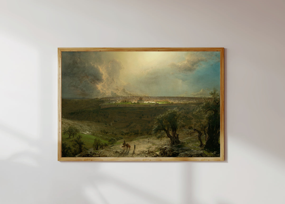 Framed art print of Jerusalem from the Mount of Olives by Albert Bierstadt, in a light wood frame on a sunlit white wall