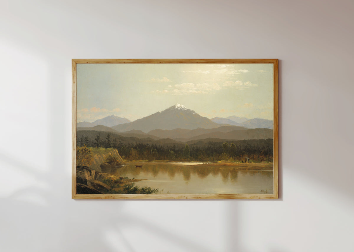 Framed art print of Laramie Peak by Albert Bierstadt, in a light wood frame on a sunlit white wall