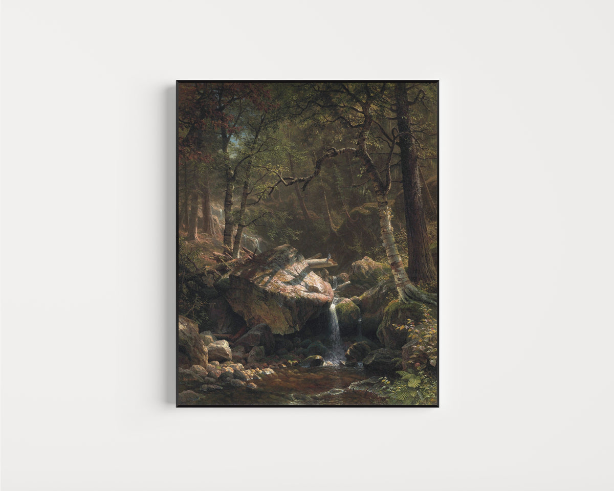 Framed art print of Mountain Brook by Albert Bierstadt, in a slim black frame on a plain white wall