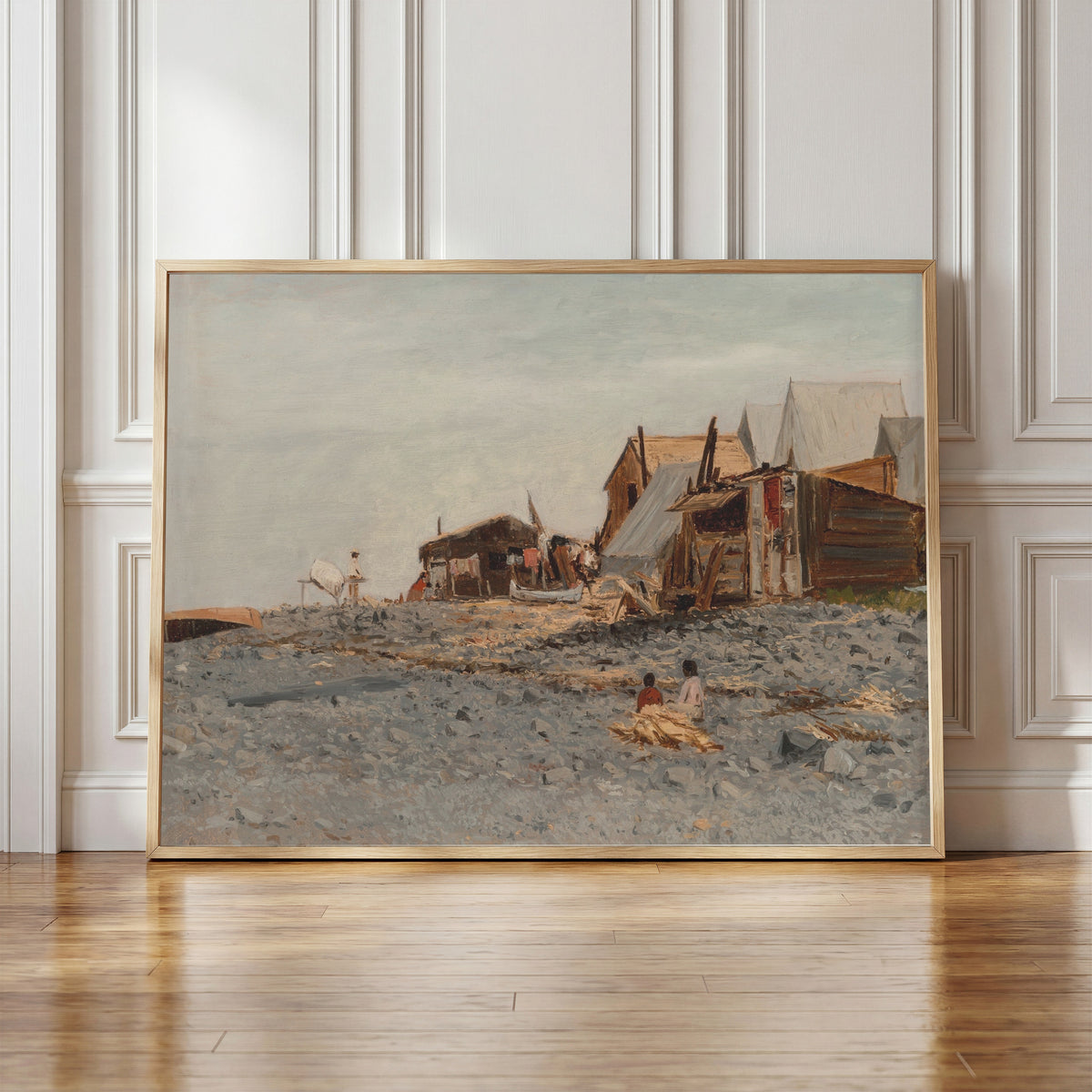 Framed art print of Salmon Fishery Village by Albert Bierstadt, in a light wood frame leaning against a panelled white wall