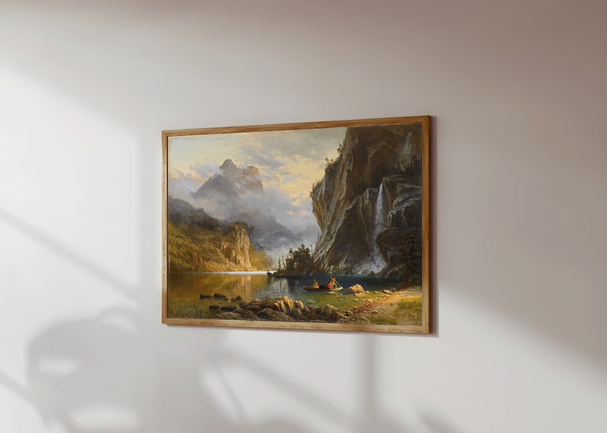 Framed art print of Spear Fishing by Albert Bierstadt, in a light wood frame on a sunlit white wall, seen at a slight angle