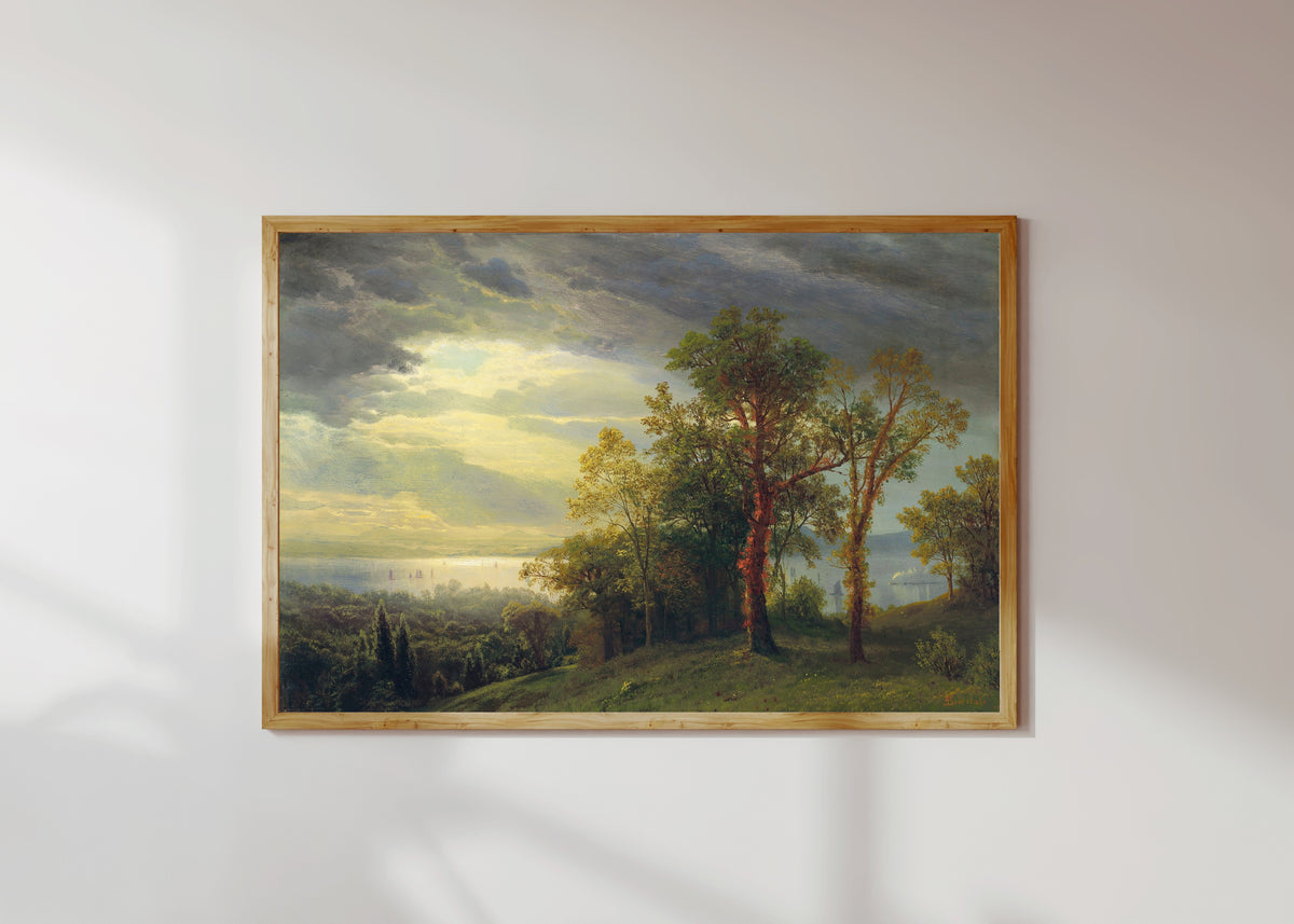 Framed art print of View on the Hudson by Albert Bierstadt, in a light wood frame on a sunlit white wall