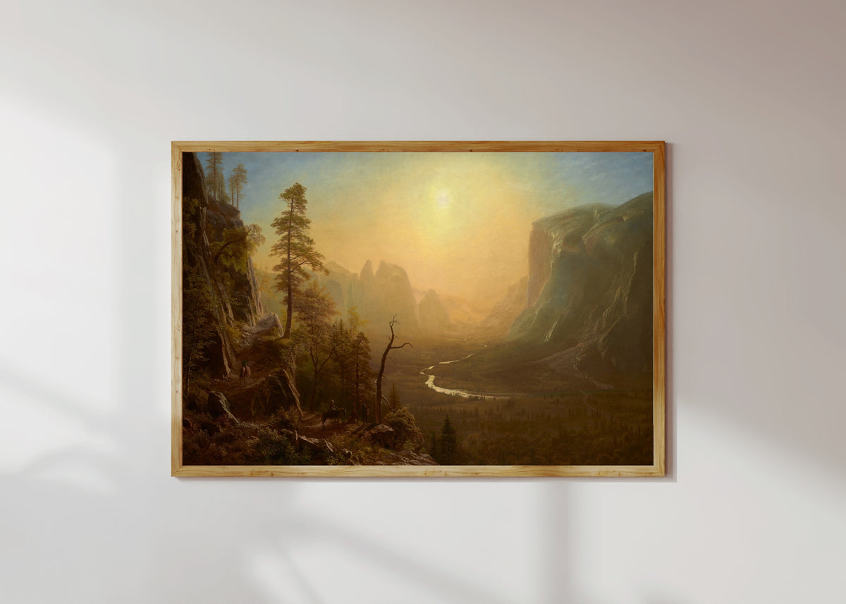 Framed art print of Yosemite Glacier Point Trail by Albert Bierstadt, in a light wood frame on a sunlit white wall