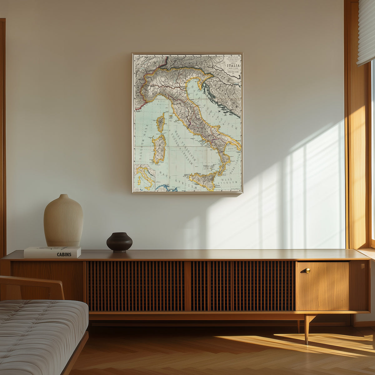 Framed art print of Italia (Tabulae Maximae) by Albert van Kampen, in a thin light frame on a sunlit wall above a wooden sideboard