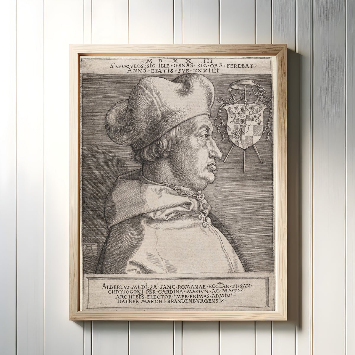 Framed art print of Cardinal Albrecht of Brandenburg (The Large Plate) by Albrecht Dürer, in a light wood frame on a white panelled wall