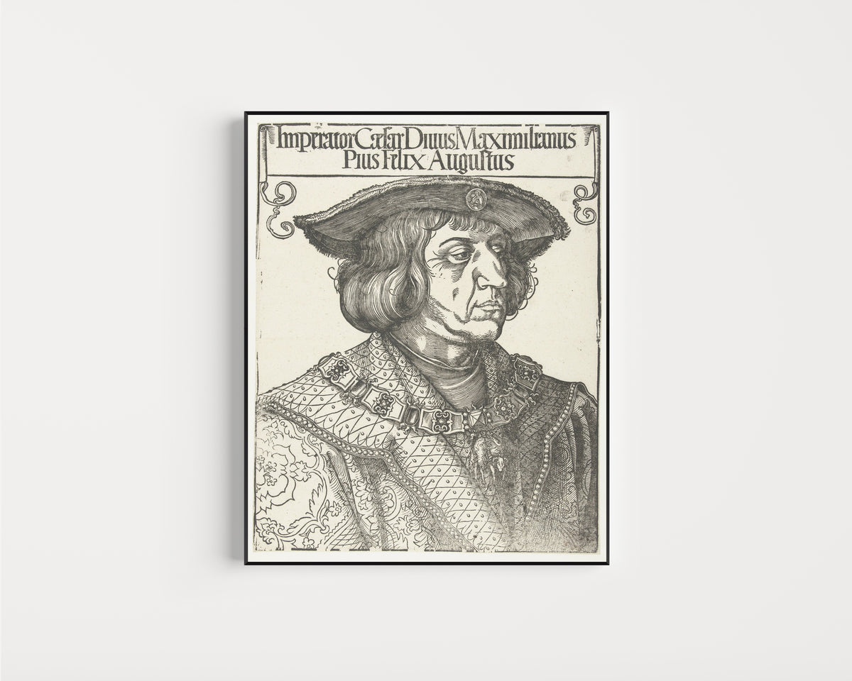 Framed art print of Emperor Maximilian I by Albrecht Dürer, in a slim black frame on a plain white wall