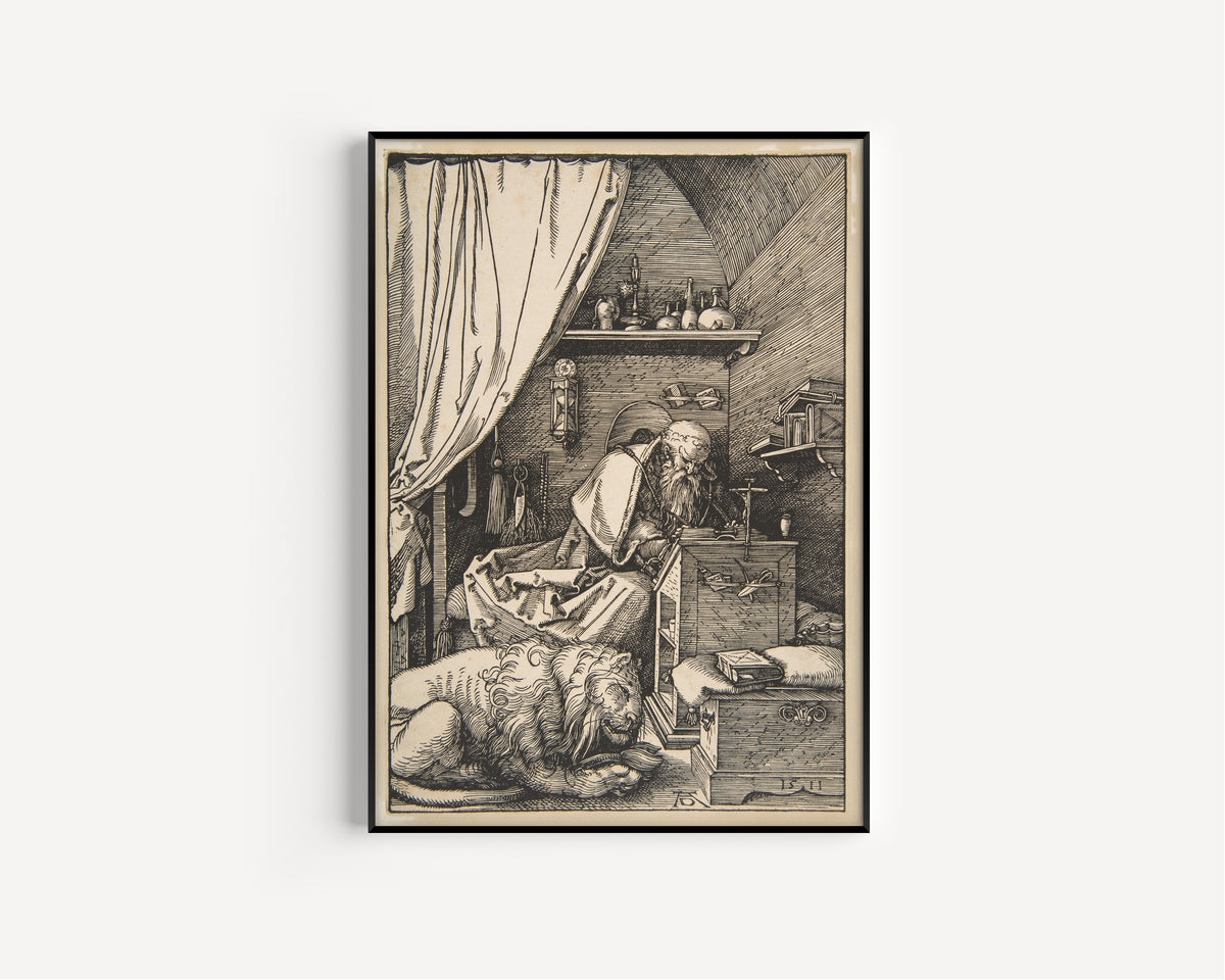 Framed art print of Saint Jerome in His Study (1511) by Albrecht Dürer, in a slim black frame on a plain white wall